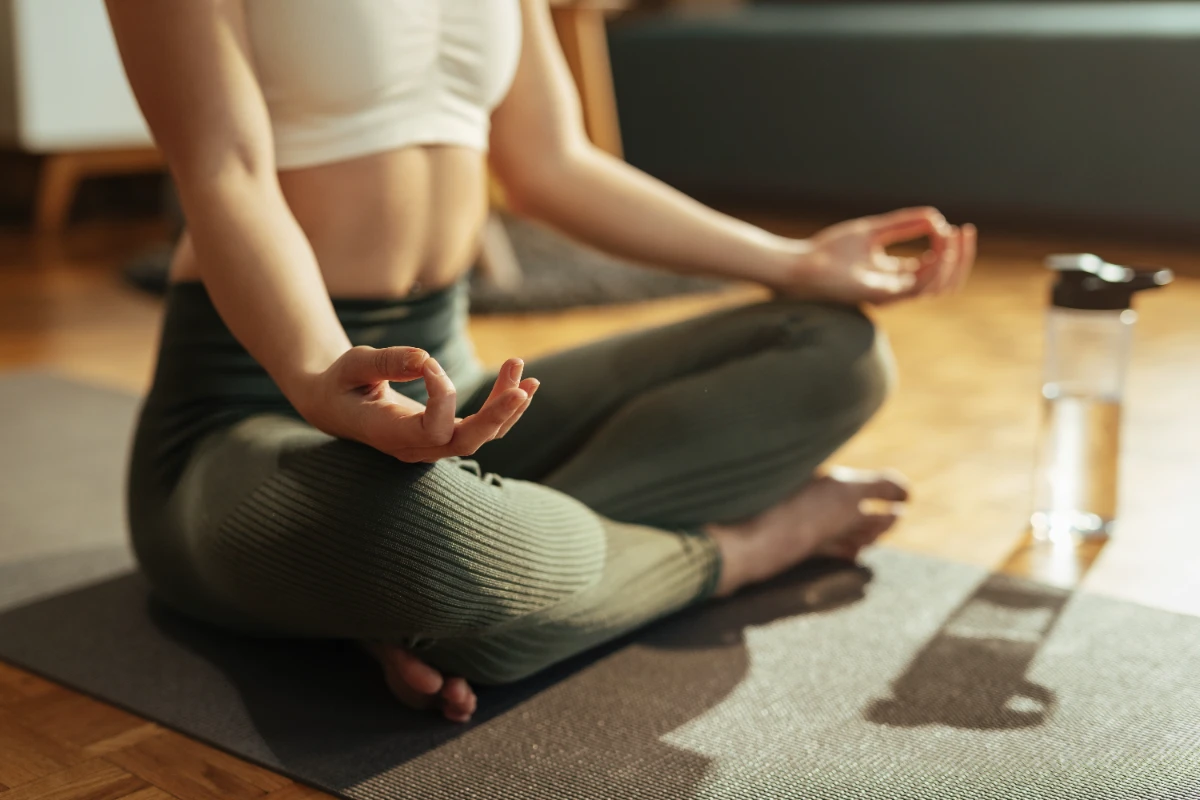closeup-athletic-woman-practicing-yoga-lotus-position